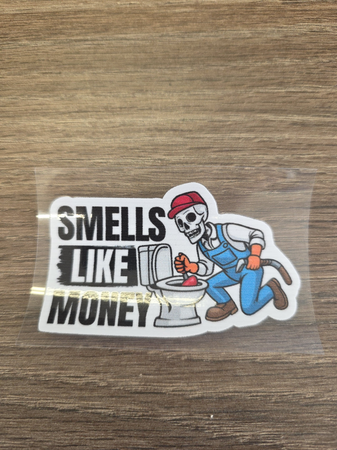 Smells Like Money Plumber Decal – UV DTF Hard Hat Sticker