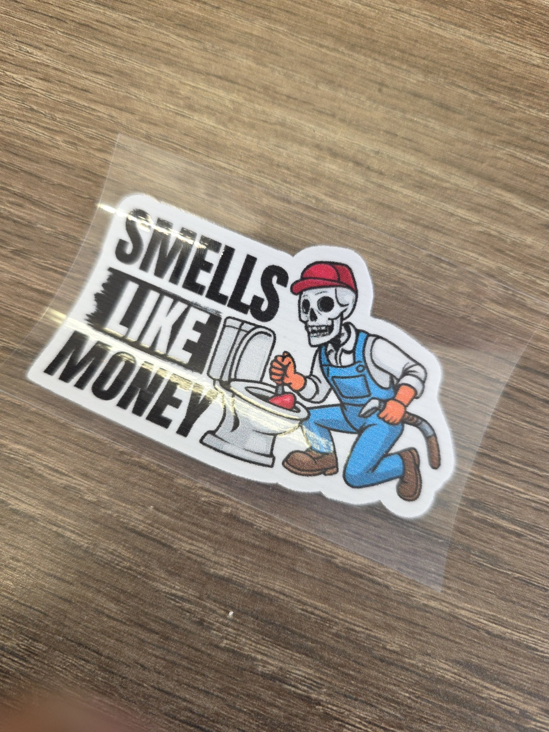 Smells Like Money Plumber Decal – UV DTF Hard Hat Sticker