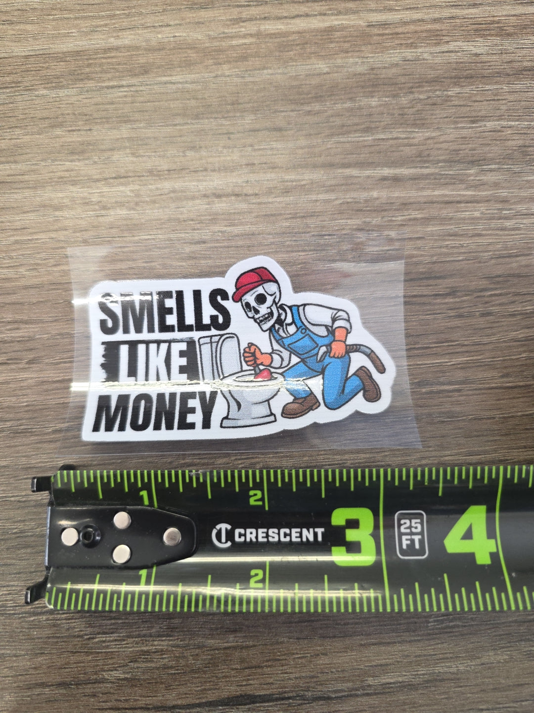 Smells Like Money Plumber Decal – UV DTF Hard Hat Sticker