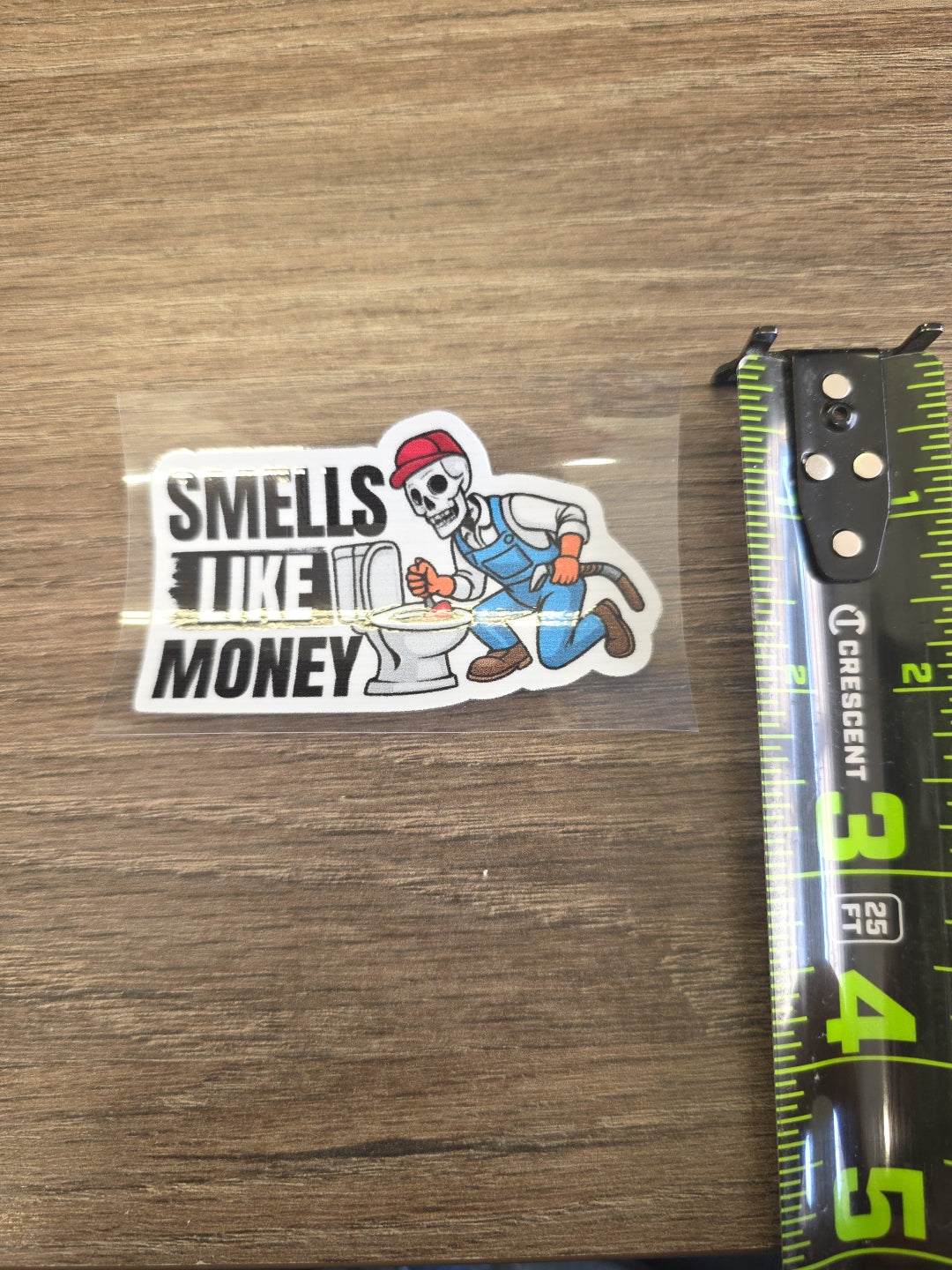 Smells Like Money Plumber Decal – UV DTF Hard Hat Sticker