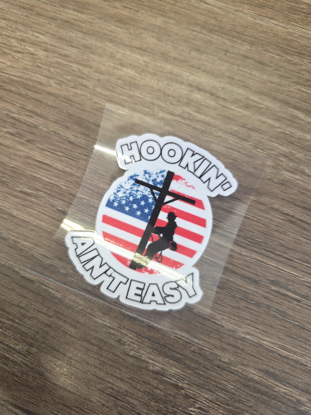 Hookin’ Ain’t Easy Lineman Decal – UV DTF Hard Hat Sticker