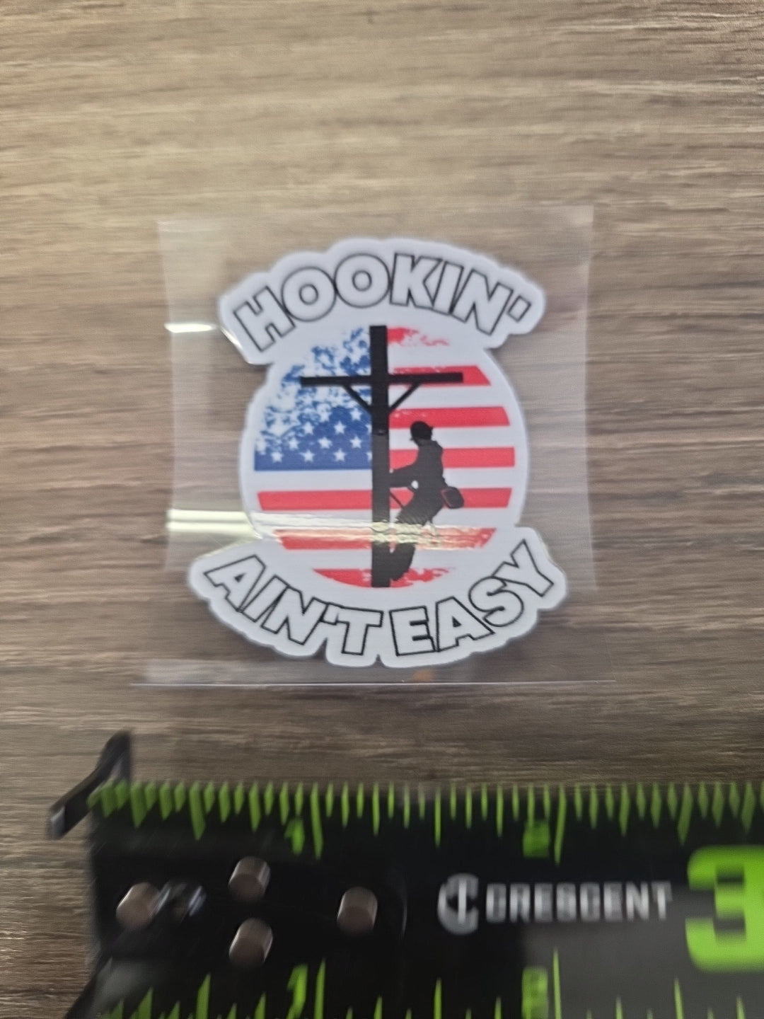 Hookin’ Ain’t Easy Lineman Decal – UV DTF Hard Hat Sticker
