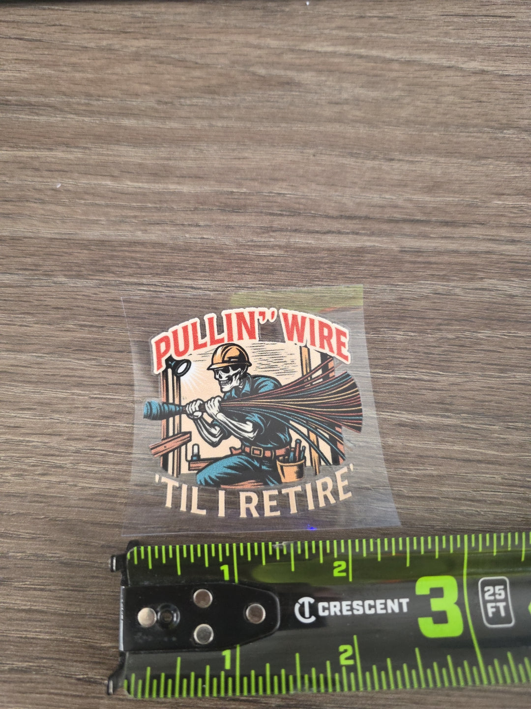 Pullin’ Wire ’Til I Retire – Electrician UV DTF Hard Hat Decal